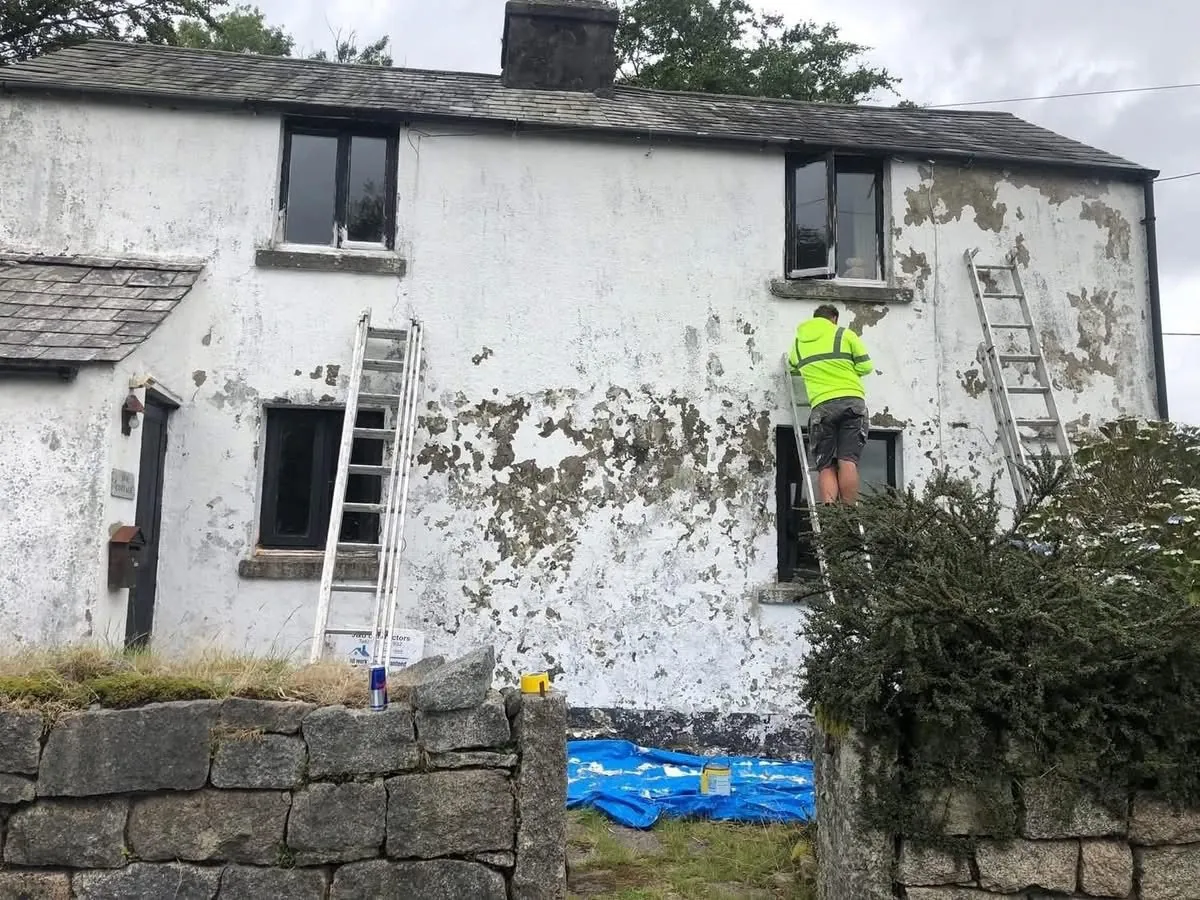 Cottage with blown, flaking render before repair in St Stephen in Brannel