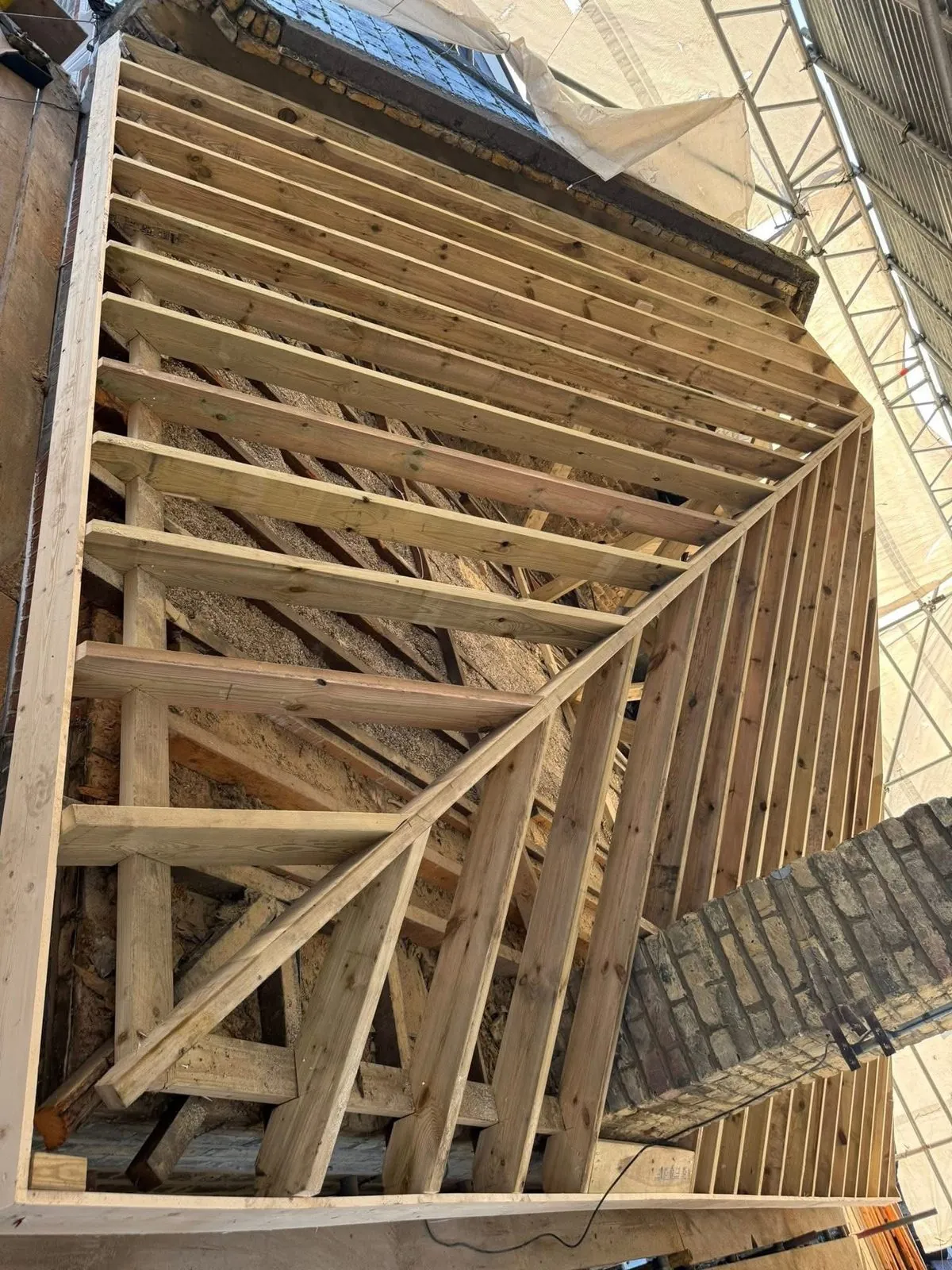 New roof timbers and rafters during a re-roof in St Stephen in Brannel